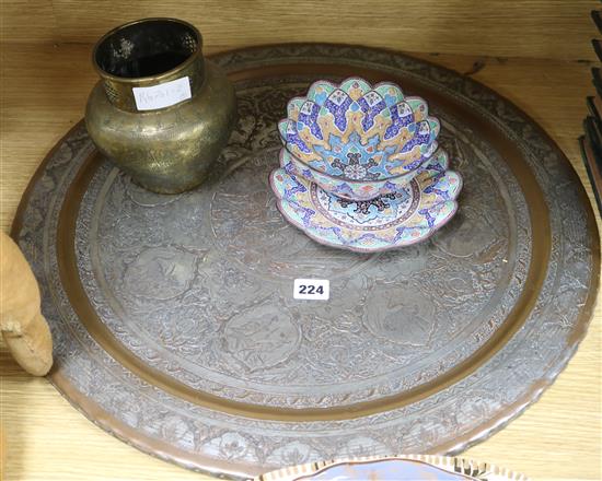 A Middle Eastern silvered copper tray, two bowls and a vase